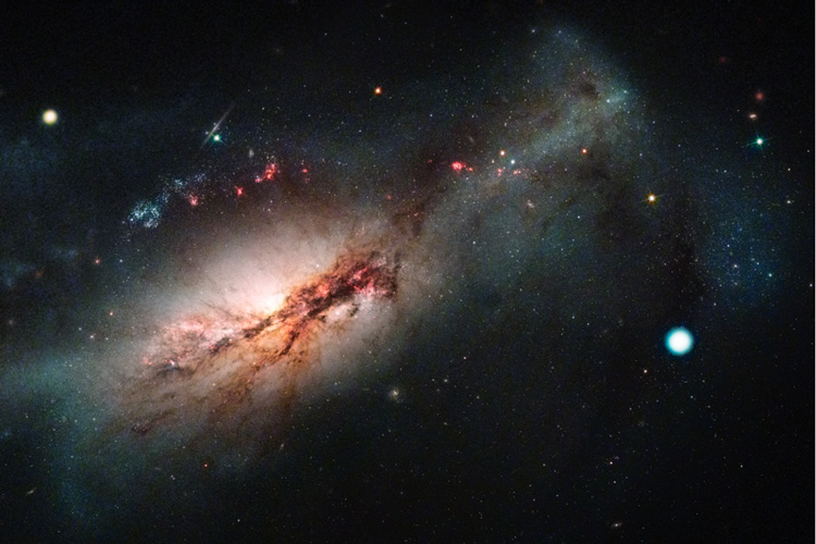 the supernova shown in the outer regions of its galaxy