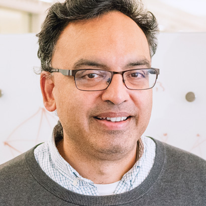 Niren Murthy in his office with whiteboard in background