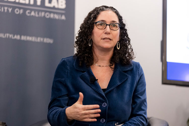 Naomi_Levy, one of the organizers of the Firsthand Framework for Policy Innovation, speaks and gestures at a recent meeting 