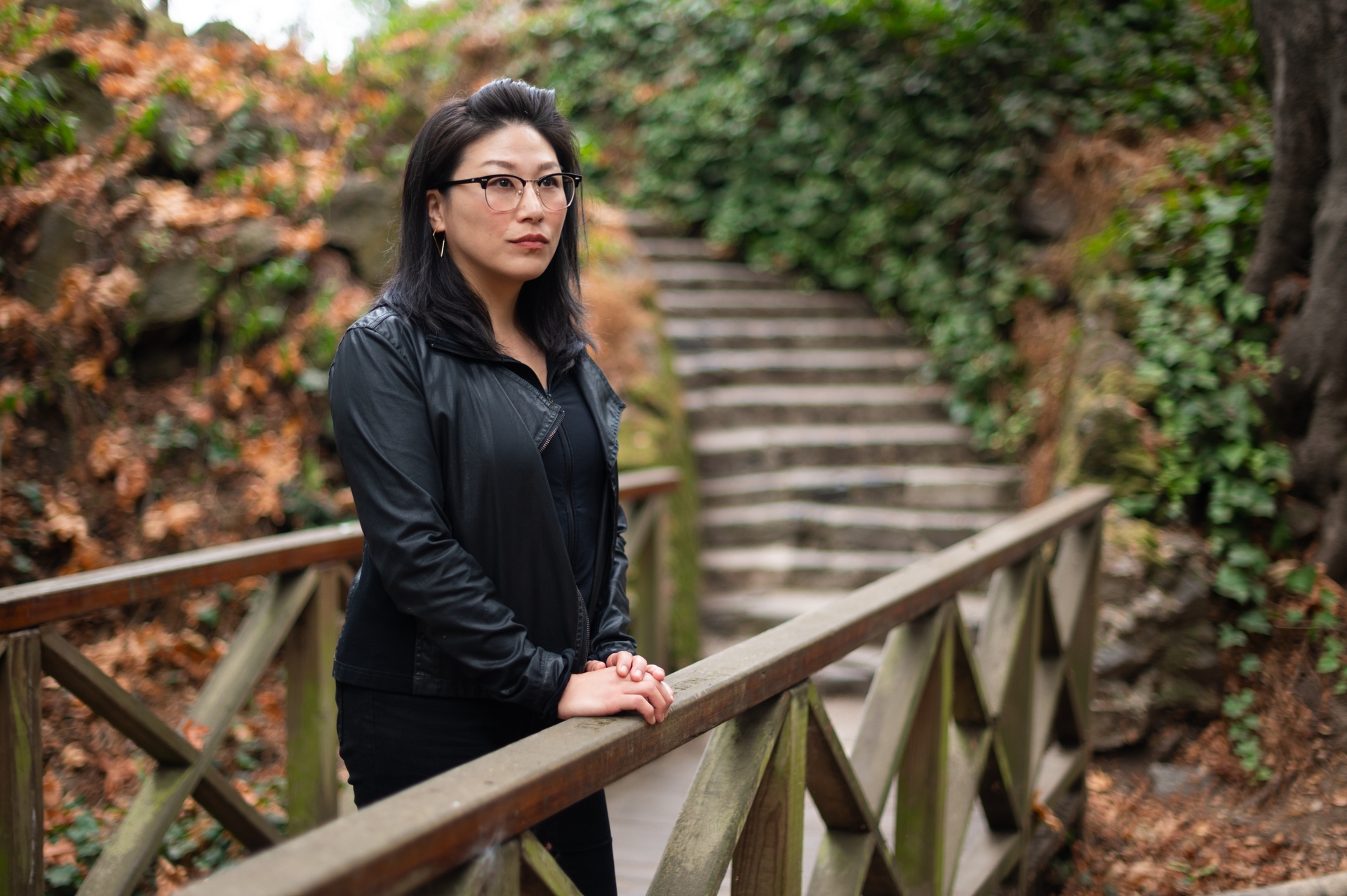 image of woman standing on bridge