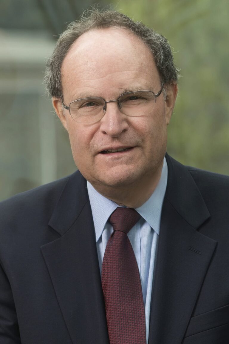 headshot of man in glasses