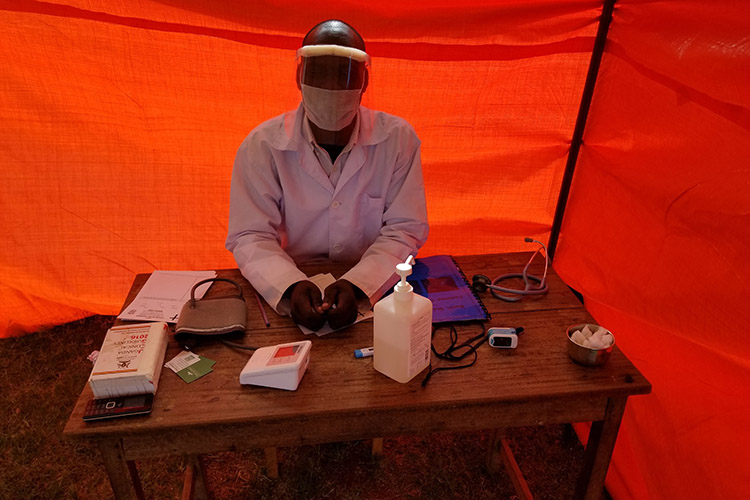 A member of the medical staff at St. Philips Medical Health Center in Gulu, Uganda, tests one of the face shields that Takataka Plastics is making for about 80 cents apiece out of recycled plastic waste. Medics in Uganda have little, if any, personal protective equipment for working with COVID-19 patients.
