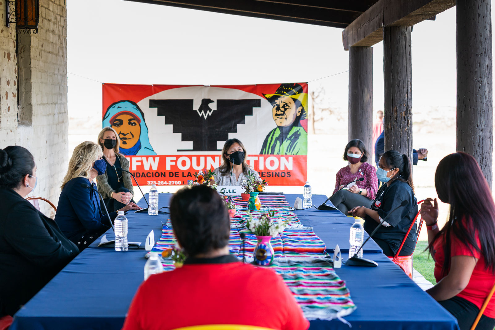 Femal members of the UFW meet at a table with first lady Jill Biden.