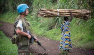 armed guard and villager