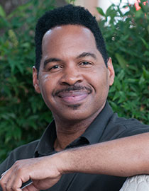 headshot of man smiling