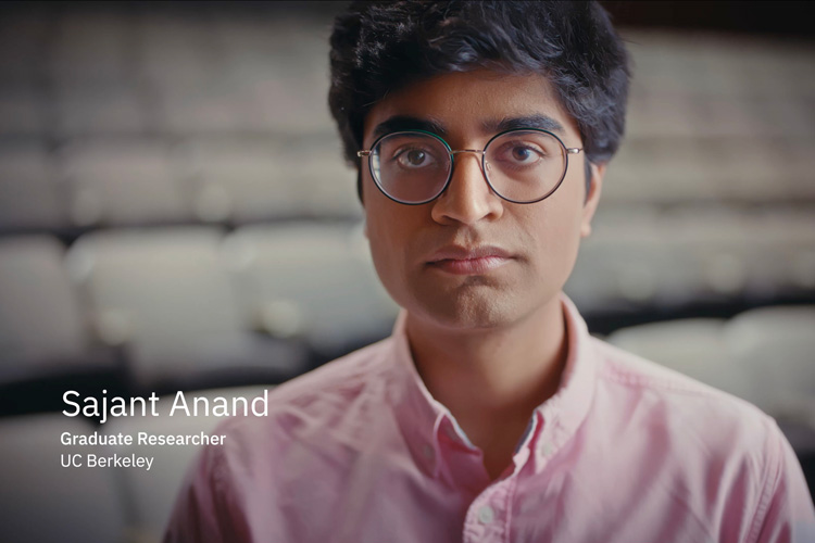 Graduate student Sajant Anand, with glasses, staring into the camera