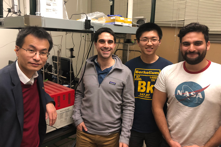 four members of team Ssweet in their lab