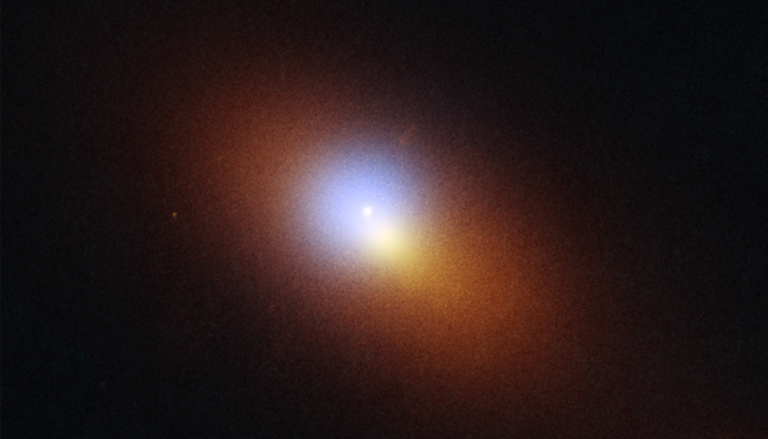elliptical orange blob with a bright blue circle next to a bright yellow blob at the center