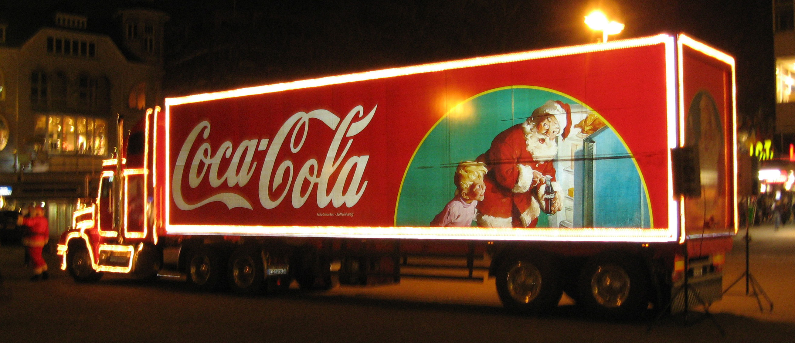 Coca Cola truck with Santa's image on it.