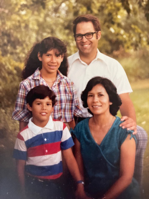David Schaffer as a young child posing with his older sister and their mother and father.
