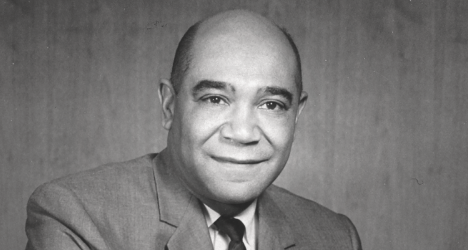 black and white photo of a man in a suit