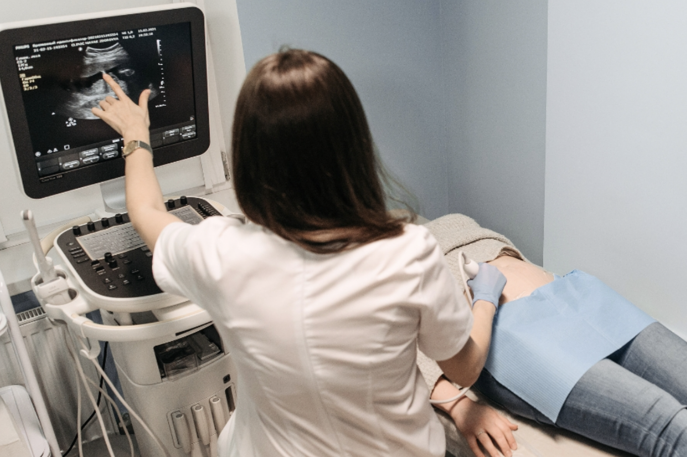 image of woman operating an ultrasound