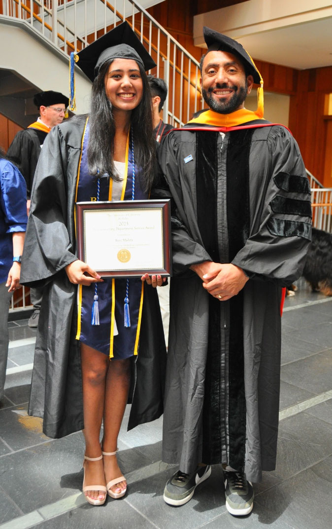 Aaron Streets with a student at graduation