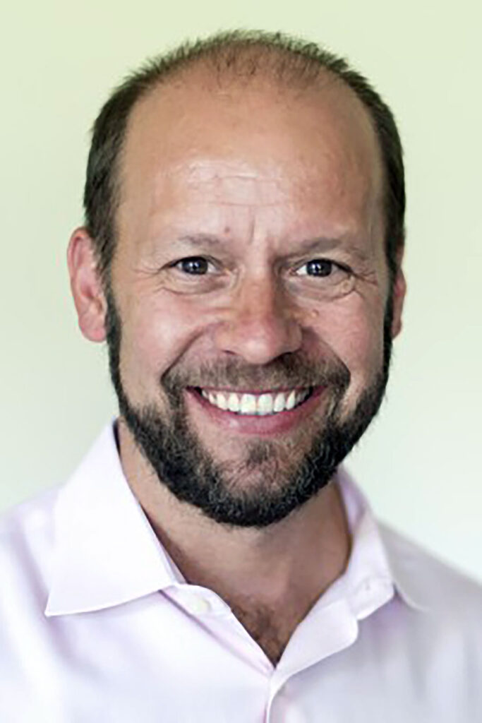 headshot of man smiling