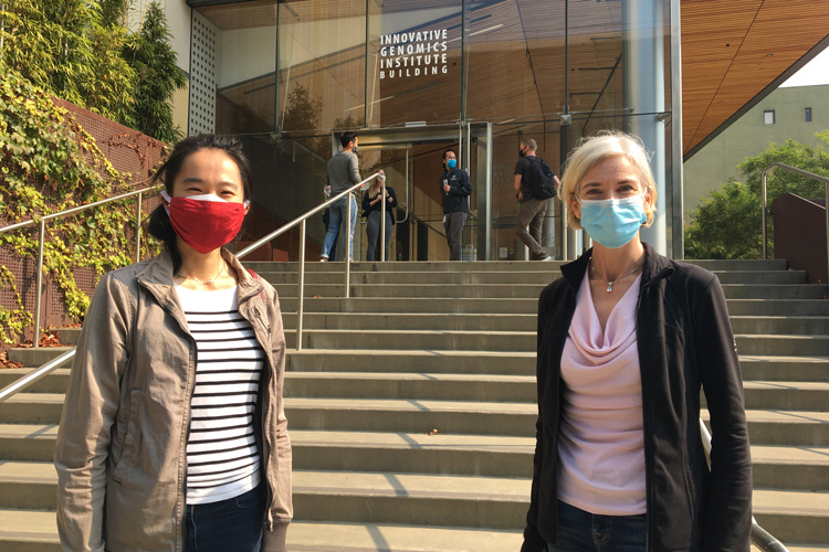 Tina Liu and Jennifer Doudna, with masks, outside IGI building