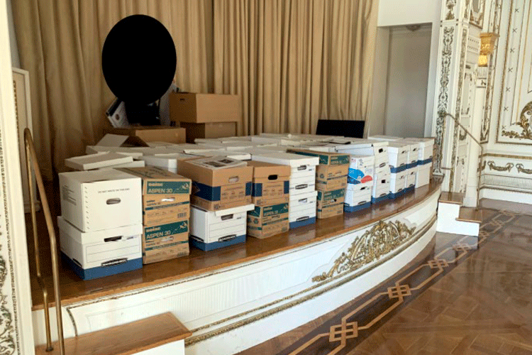 Dozens of bankers boxes, some possibly containing classified documents, stored on an unsecured Italianate stage at former President Donald Trump's Mar-a-Lago residence in Florida.