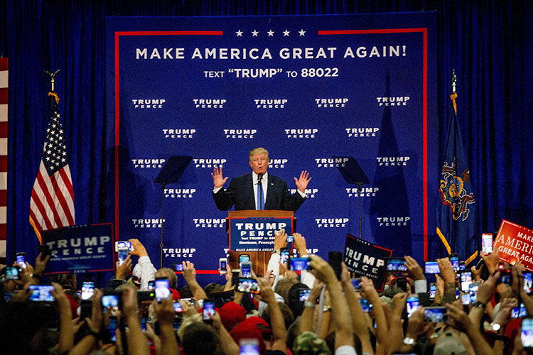 Trump stands before a cheering crowd at a 2020 campaign event