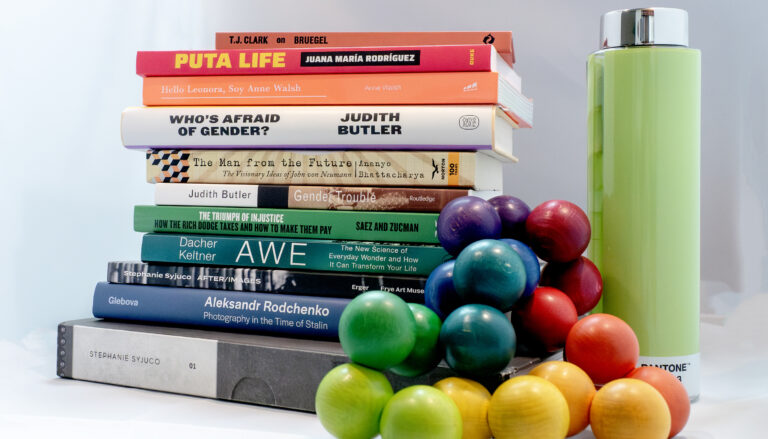 a stack of about a dozen books by UC Berkeley authors