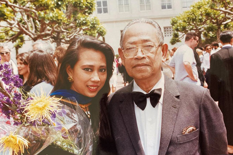 Old photo of Khatharya Um at her Berkeley graduation with her father