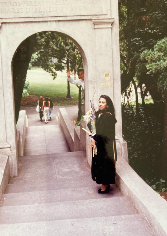 Khatharya Um posing on campus during graduation in 1990
