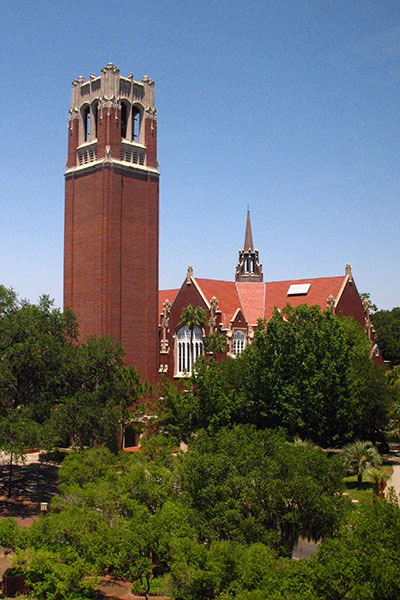 Century Tower and the University Auditorium rise from a tree-shaded campus at the University of Florida