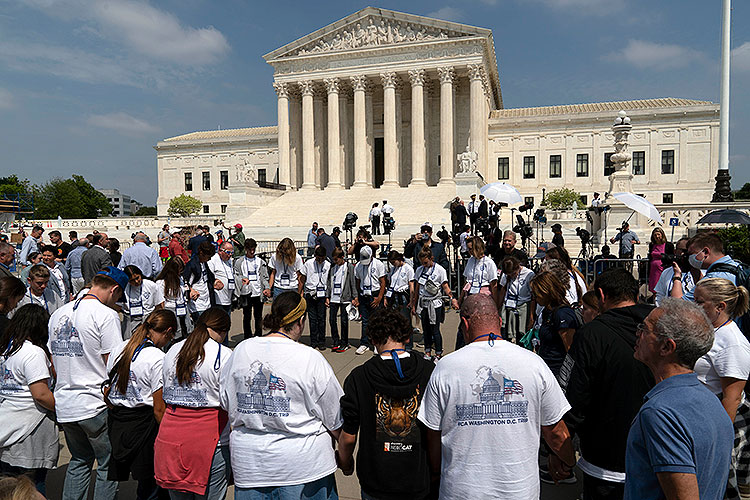 Anti-abortion protesters hold a daytime prayer vigil at the U.S. Supreme Court in Washington, D.C.