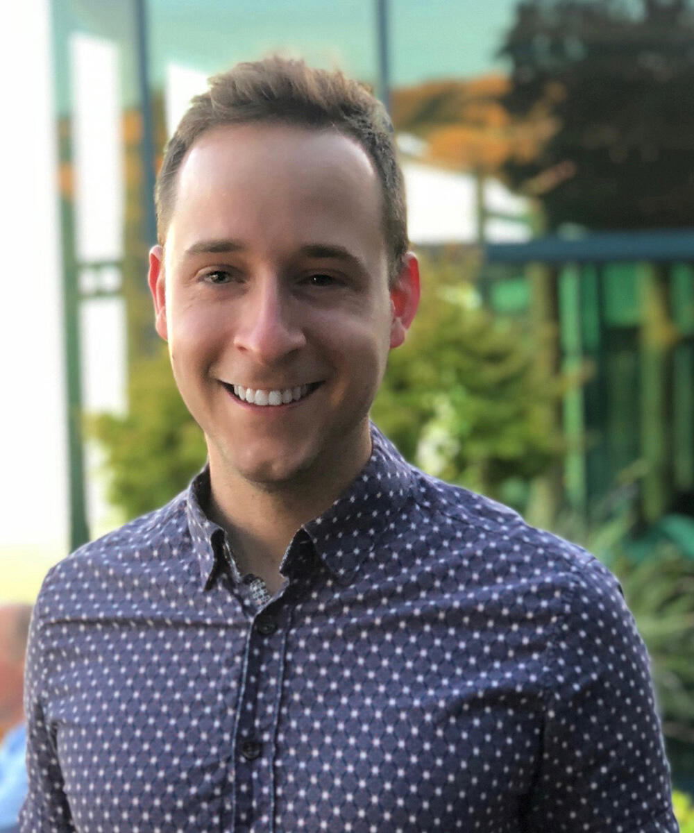 image of headshot of man smiling