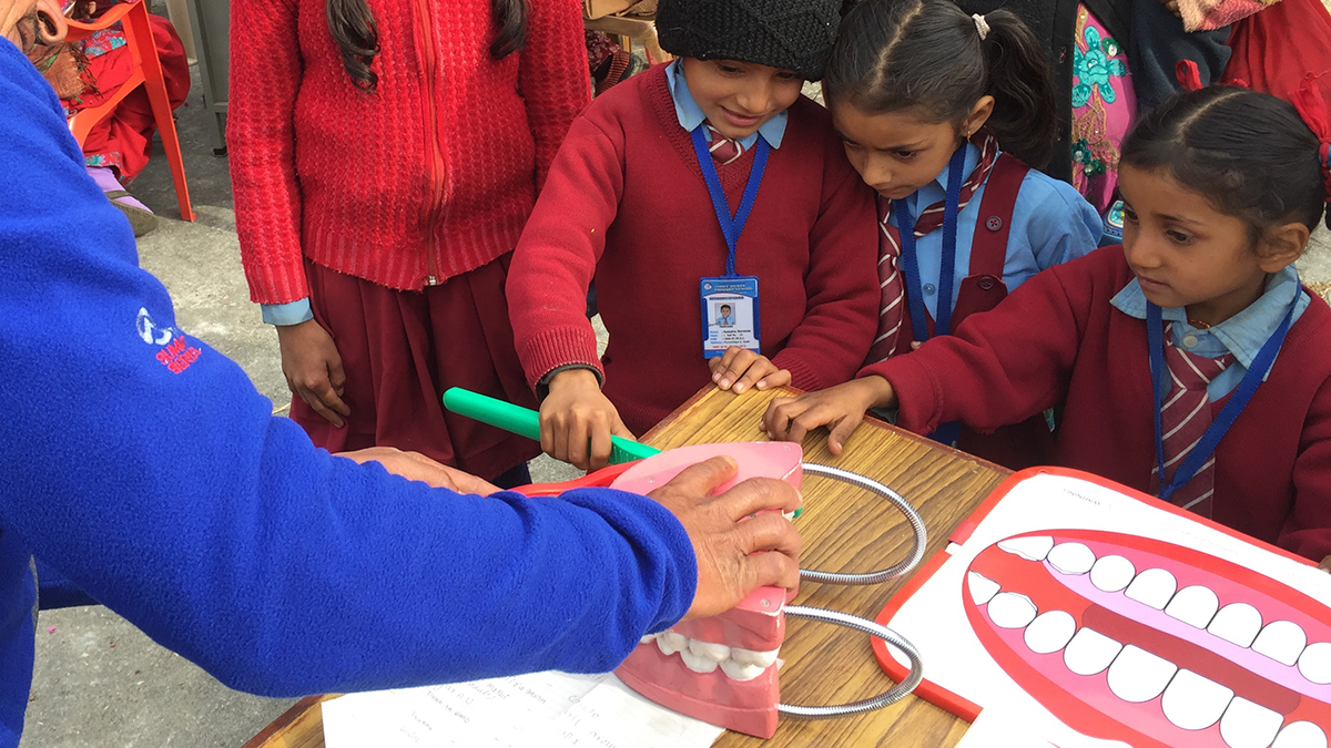 Children learning proper brushing techniques