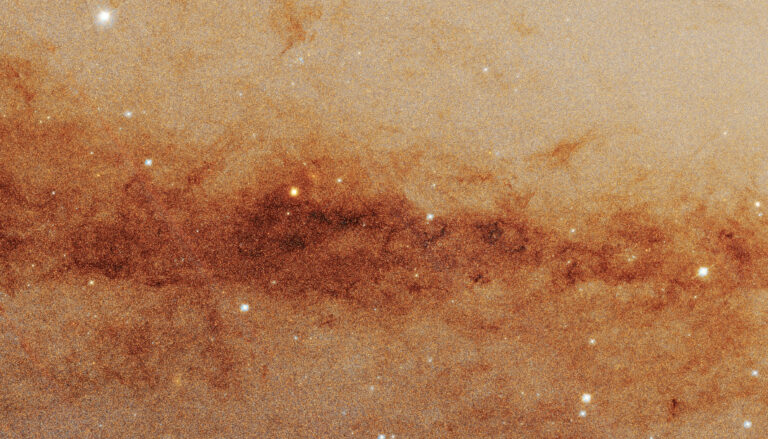 rusty red lane of stars bisecting yellowish background