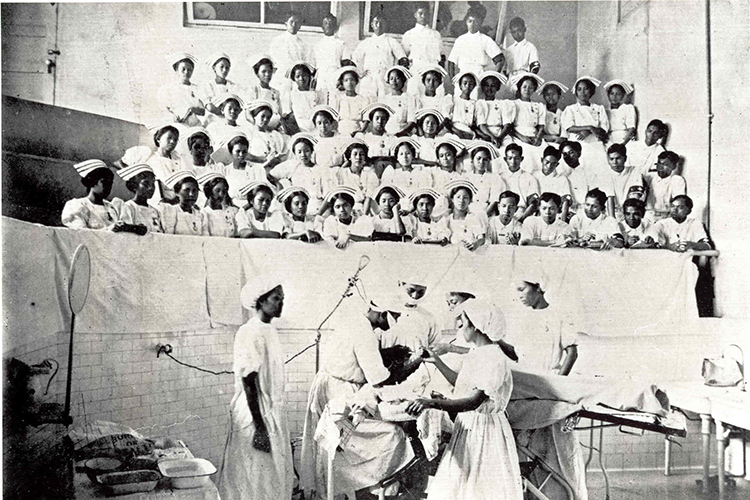 a class of nurses watch an operation