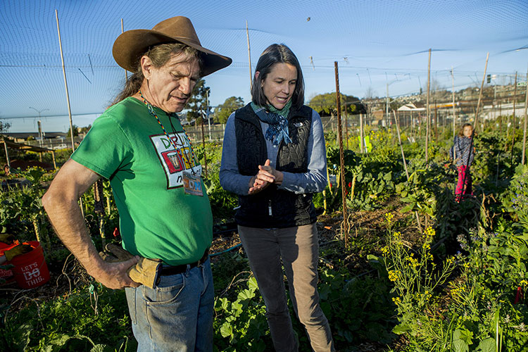 Jennifer Sowerwine and Jon Hoffman in discussion in farm setting.