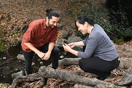 Baoxia Mi with student collecting water sample