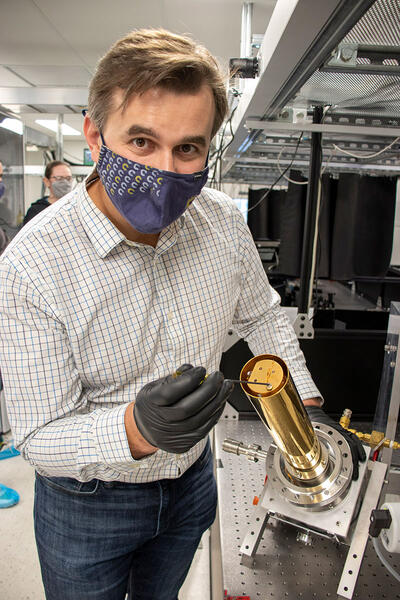 Michael Zuerch assembles a cryogenic sample holder.