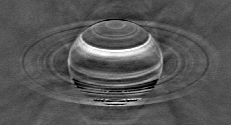 this black and white image, which looks like a sombrero, shows bright and dark bands in Saturn's atmosphere