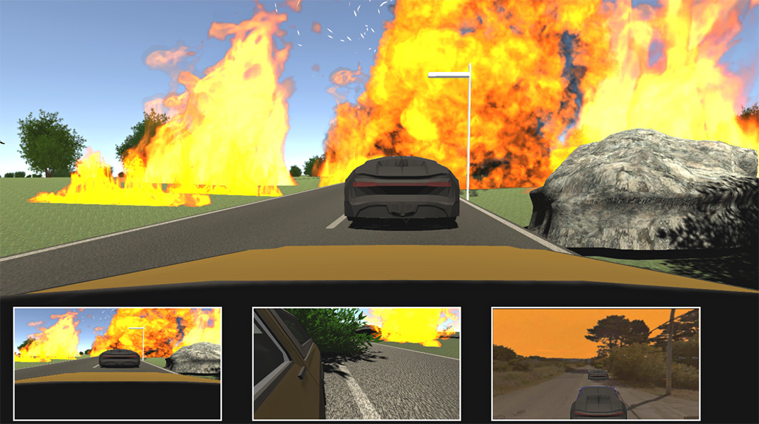 A screen capture of a video game. At the center of the screen is a view out the front windshield of a car, showing another vehicle on the street ahead. Pixelated trees and rocks appear on both sides of the street. Large plumes of wildfire appear across the view, with an intense blaze on the street ahead. At the bottom of the image are three inset images showing the different views the player can select: the front view, a side-mirror view and a rear view. The side view also shows trees and flames, and the rear view shows trees, a line of cars on the street behind the player vehicle and a hazy sky, but no flames.