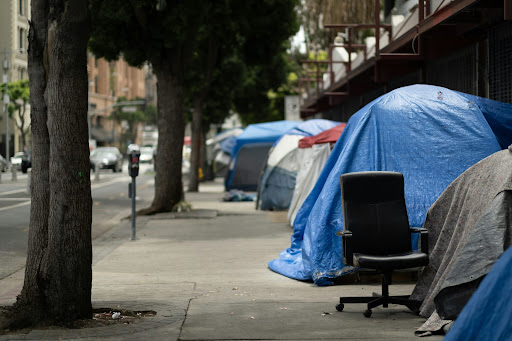 image of a couple of tented homes on the sidewalk