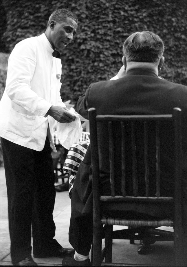 Black waiter attends to white diner in 1941 historic photo