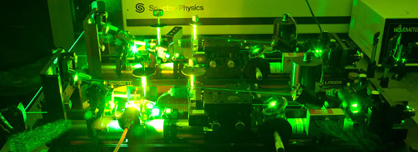 a laser casting green light over the chamber.