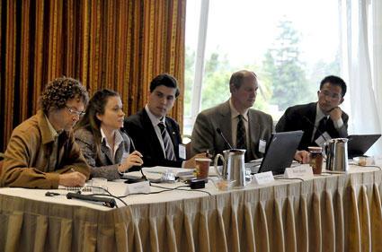 Five researchers speak on a panel.