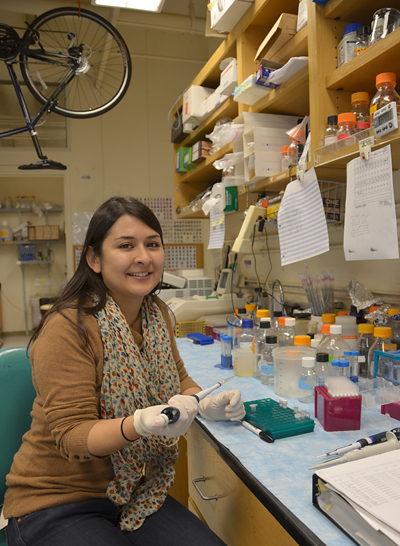 Garcia works with micro pipetting in a lab.