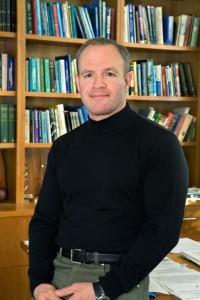 Keasling stands in a library.