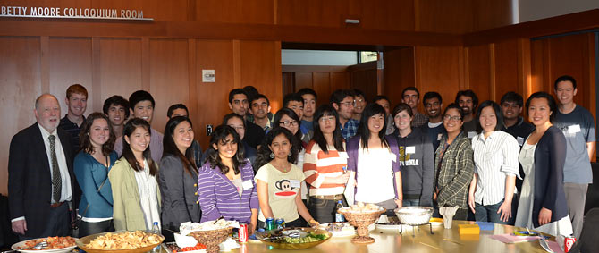 Interns gather around a table.