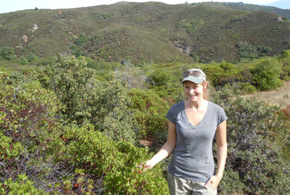 UC Berkeley researcher Erica Newman, pictured in front of chaparral, wheremmunities.