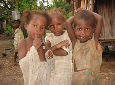 Three young girls pose for the camera.
