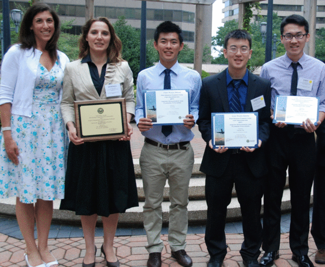 Five students present their awards.