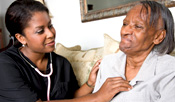 A nurse helps a patient.