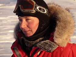 Postdoc Eline Lorenzen dressed for Arctic weather while taking tissue samples of polar bears in Greenland.