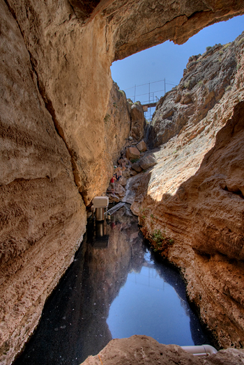 View of the aquifer-fed pool in Devils Hole, Death Valley National Park, Nye County, Nevada. The water surface is approximately 3 meters wide and 20 meters long. Photo: John Wullschleger, National Park Service