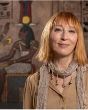 Rita Lucarelli with egyptianizing background