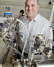 Professor Lane Martin poses with one of his advanced deposition tools.